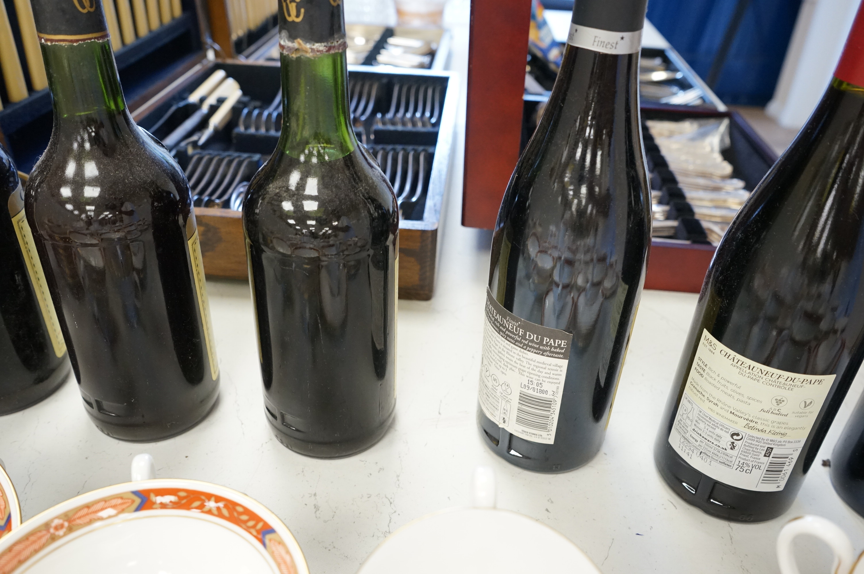 Eight bottles of red wine including three bottles of Chateau Talbot Saint Julien 1975, Chateauneuf du Pape 2008, Chateau Caronne Ste Gemme 1988 etc.